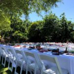 Party table and chair rental setup in phoenix backyard.